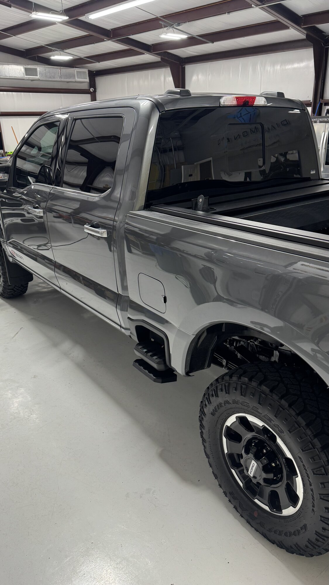Gray Ford Super Duty with window tint