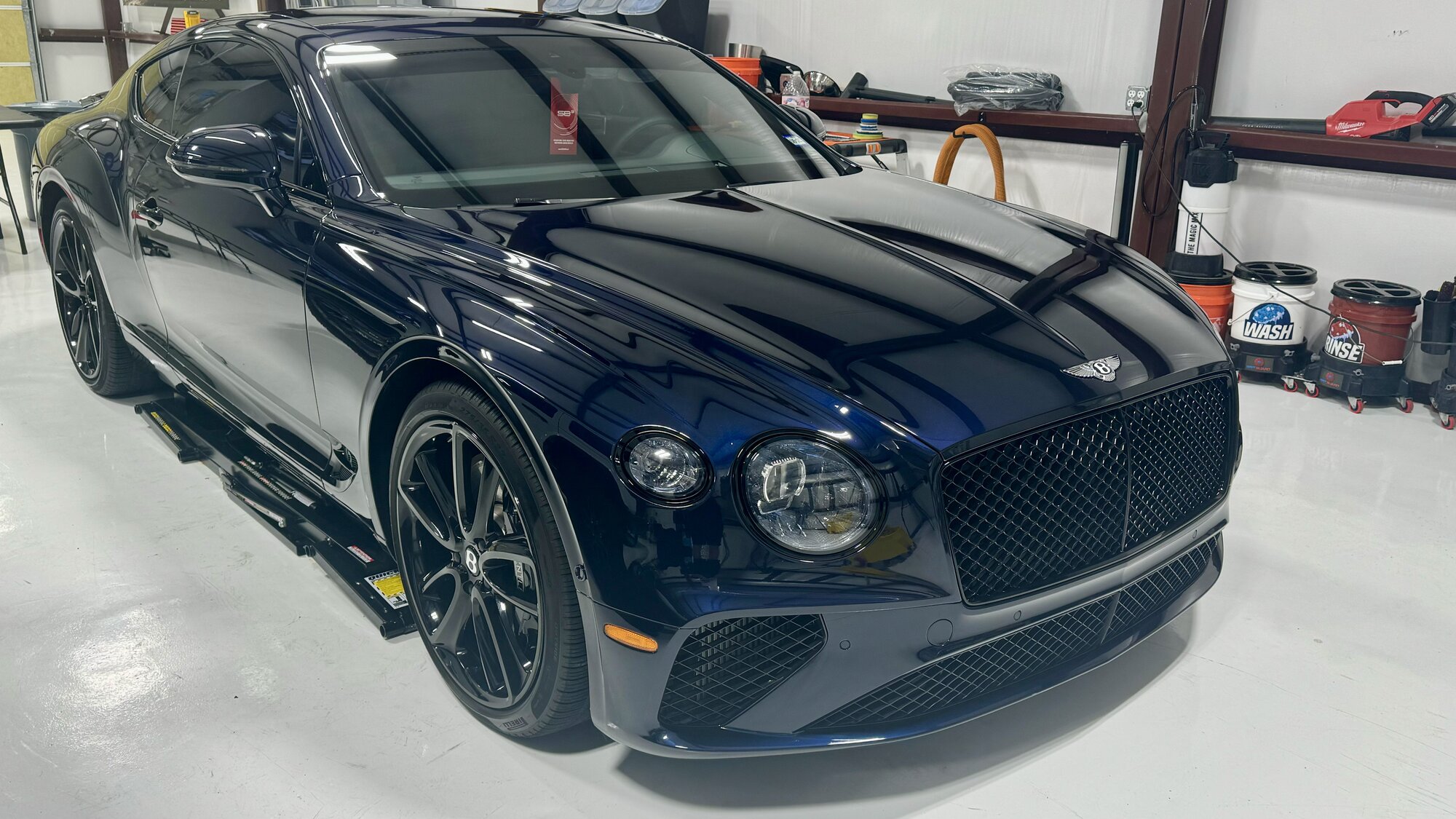 Dark blue Bentley Continental GT with paint protection film in the studio