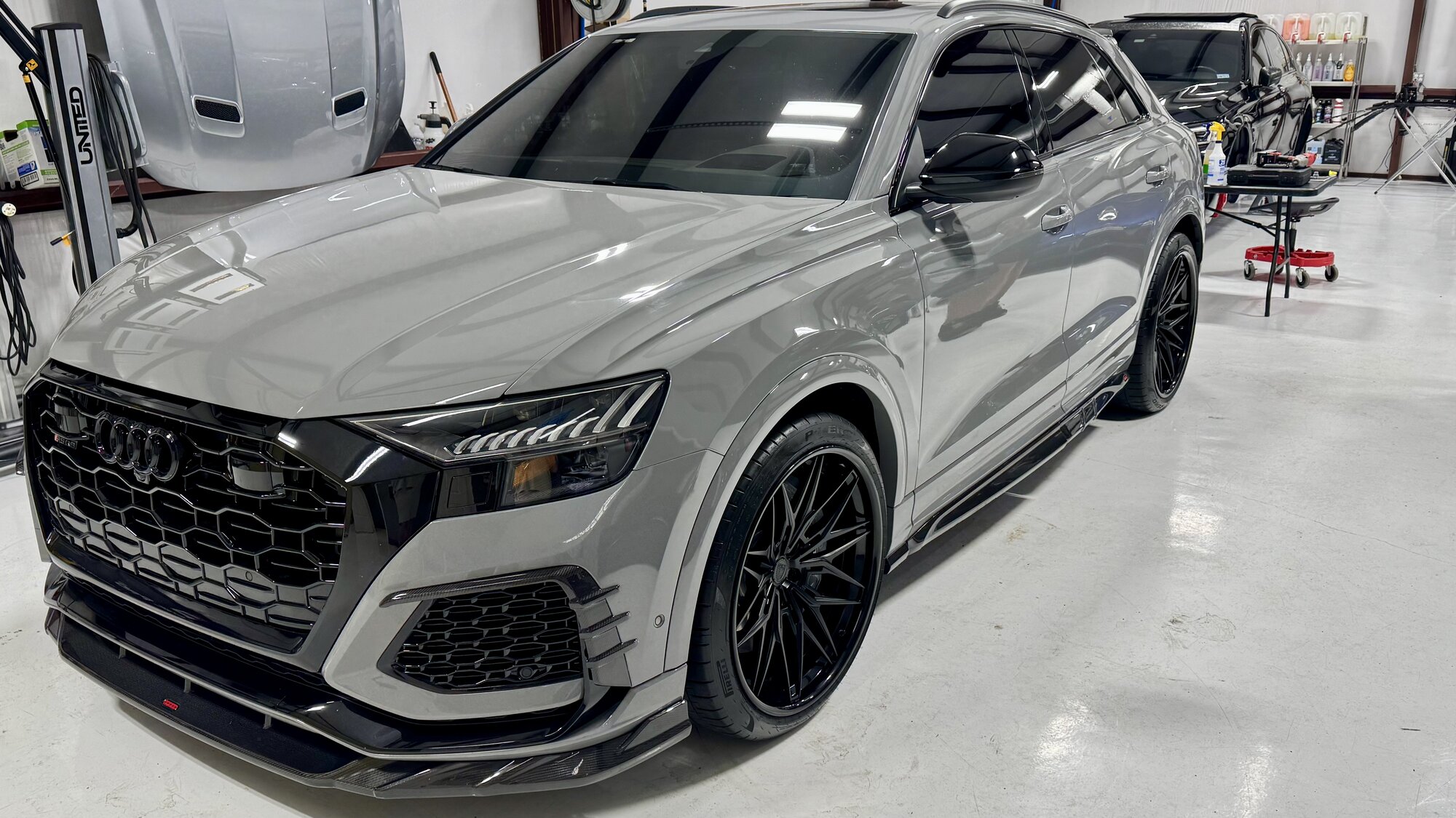 Grey Audi RS Q8 with ceramic coated black wheels in the studio