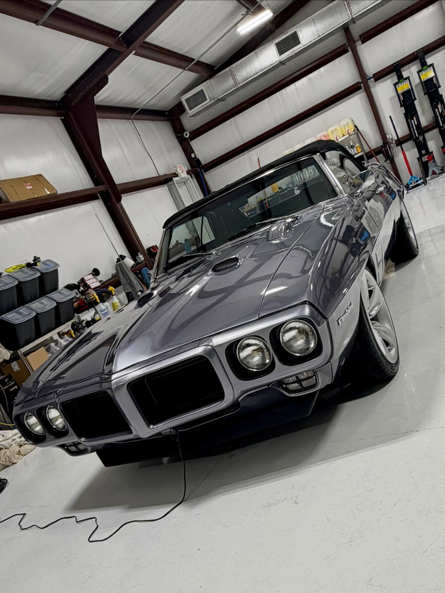 Gray 1969 Pontiac Firebird restomod convertible after a wash, interior and engine bay detail