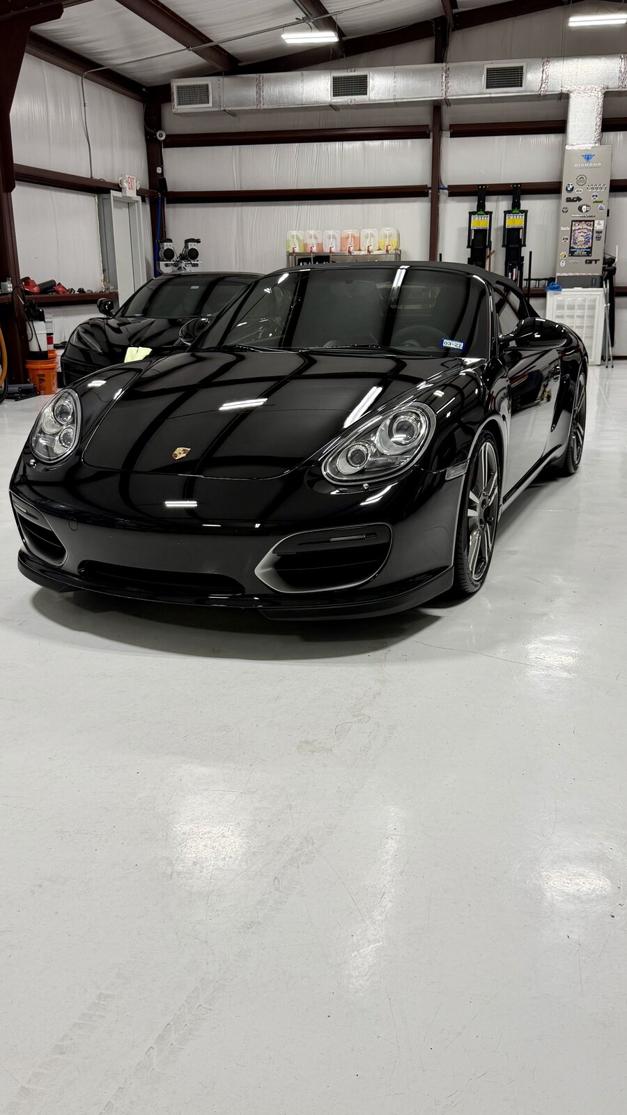 Black Porsche Boxster with ceramic coating in the studio